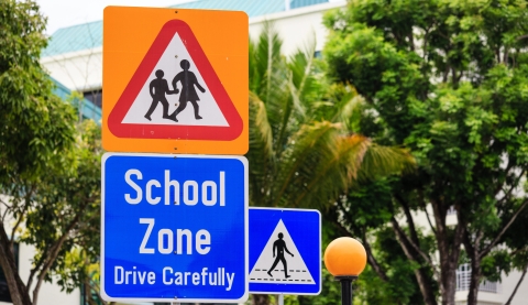 yellow color warning school zone traffic sign